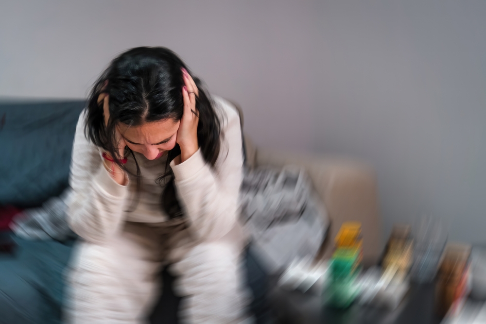 Young,Woman,Experiencing,Severe,Migraine,Headache,And,Dizziness