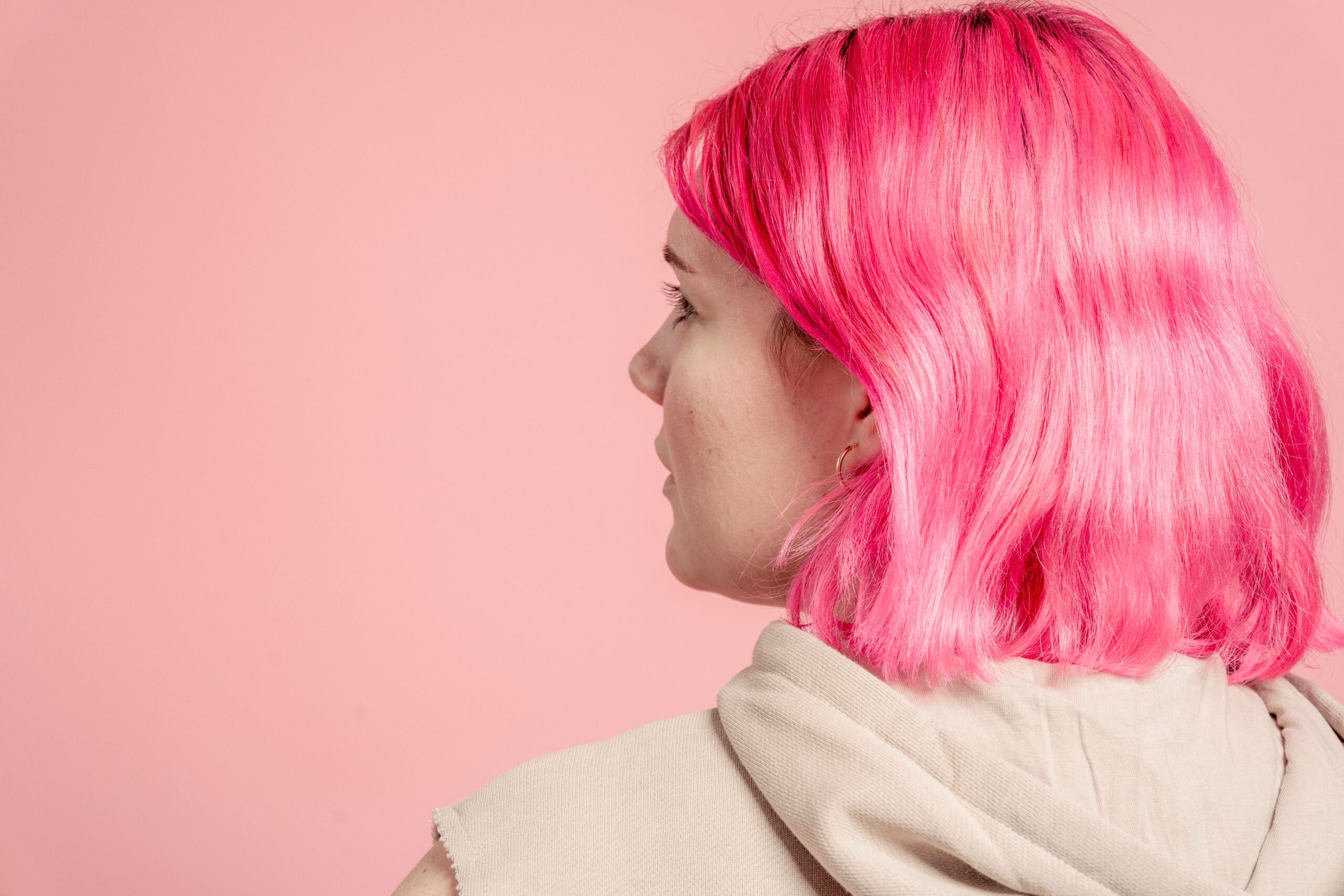 Employee Wears Ridiculous Wigs After Company Rejects Pink Hair
